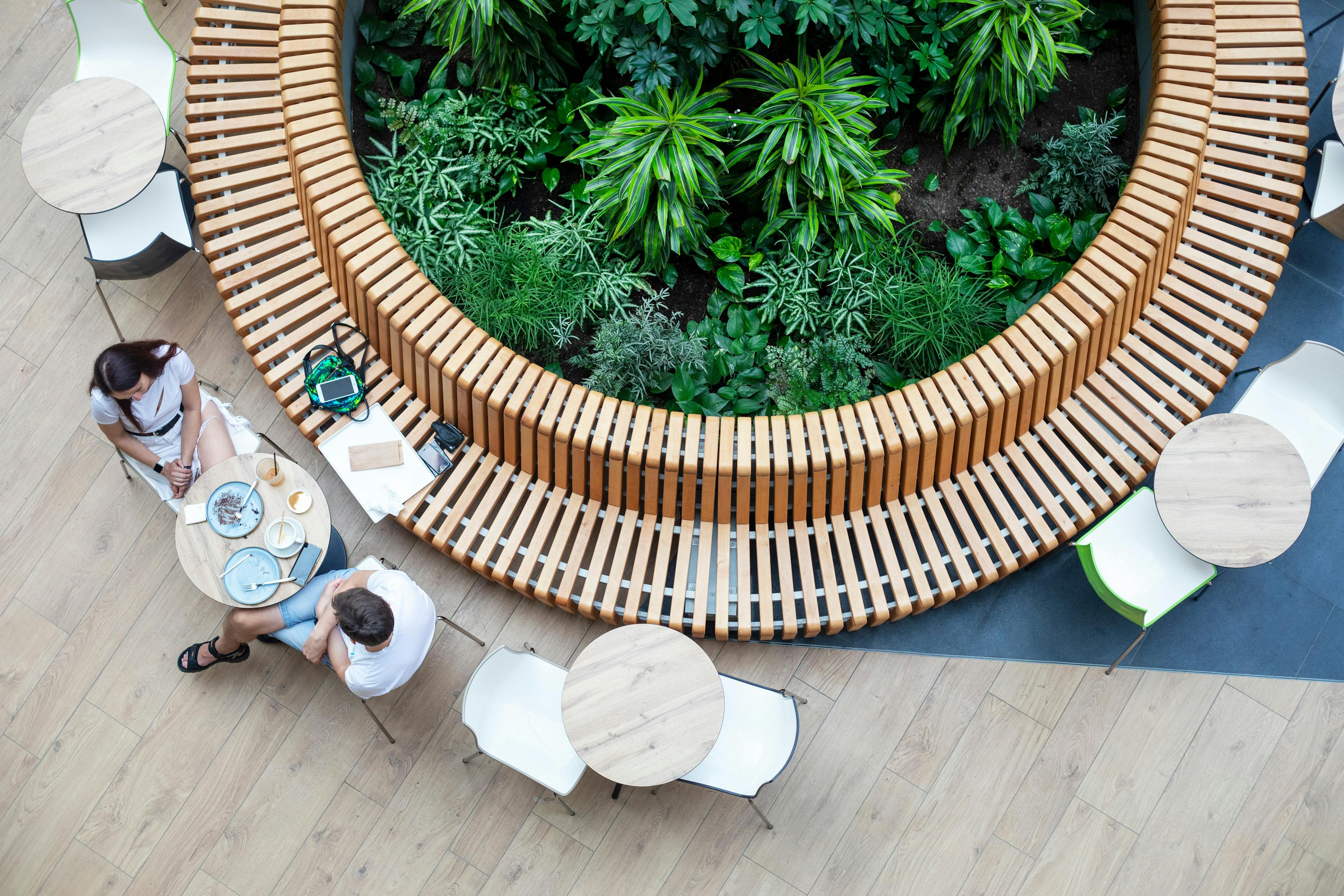 two people eat at open-air cafe in a mixed-used mall